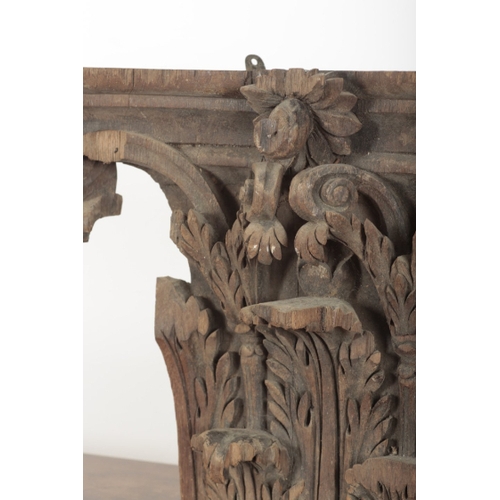 78 - A CARVED OAK CORINTHIAN CAPITAL possibly 18th century, affixed with hanging hooks to the reverse, 47... 