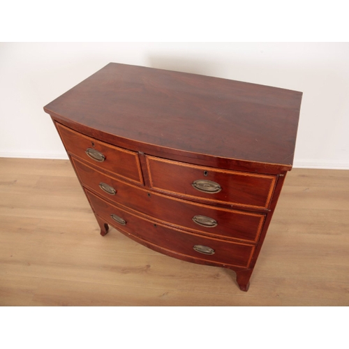 88 - A GEORGE III MAHOGANY AND SATINWOOD CROSSBANDED BOW FRONT CHEST OF DRAWERS the two short drawers and... 