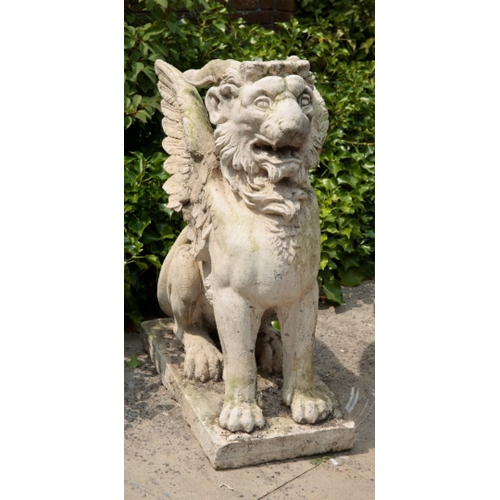 91 - A PAIR OF COMPOSITE STONE GRIFFONS modelled seated on rectangular plinths, each 95cm high x 70cm lon... 