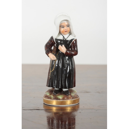 92 - TWO SIMILAR CONTINENTAL PORCELAIN FIGURES depicting a nun and a pastor, each 12.5cm high (2)