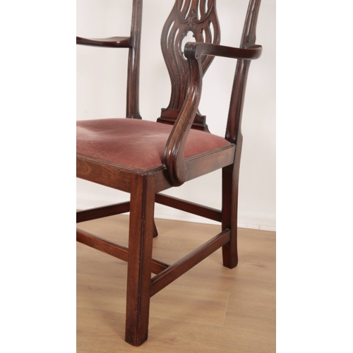 93 - A GEORGE III MAHOGANY ARMCHAIR the shaped cresting rail over a pierced vase shaped back splat, a dro... 