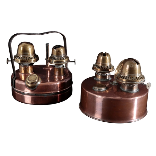 109 - TWO PARAFFIN HEATERS one with a copper body, two brass burner units, brass filler cap and fuel gauge... 