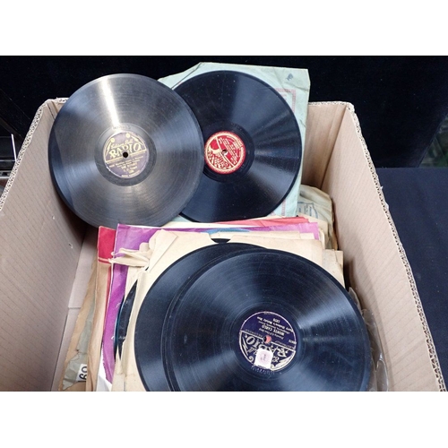 110 - AN HMV  PORTABLE GRAMOPHONE (running, carry handle missing) with a collection of 78 rpm records, wit... 