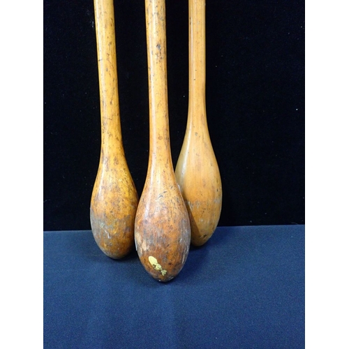 165 - A SET OF THREE TURNED WOOD ' INDIAN CLUBS'