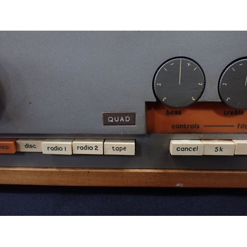 36 - A QUAD 303 TUNER AND AMPLIFIER with a folder of related information