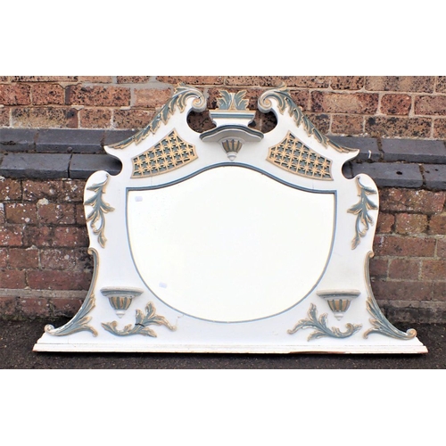 799 - A LATE VICTORIAN LOUIS XV STYLE OVERMANTEL MIRROR, PAINTED WHITE with shield-shaped plate within a c... 