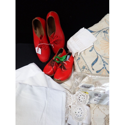 88 - A QUANTITY OF OLD LINENS tablecloths etc, and two pairs of red leather and wood Northumbrian clogs (... 