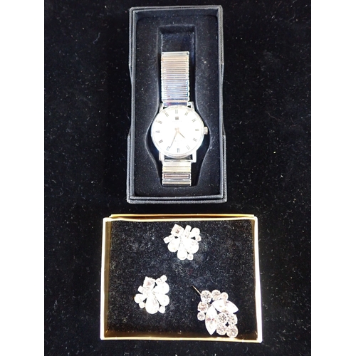 436 - A TISSOT STAINLESS STEEL GENTLEMANS' WATCH with a pin and earings set of custume jewellery