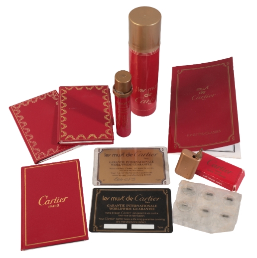 CARTIER A LIGHTER FLUID REFILL and a Cartier gas refill tank in