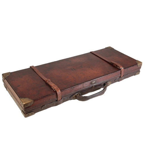 186 - C.G. BONEHILL, BIRMINGHAM: AN OAK AND LEATHER DOUBLE GUN CASE with brass corners and red painted int... 