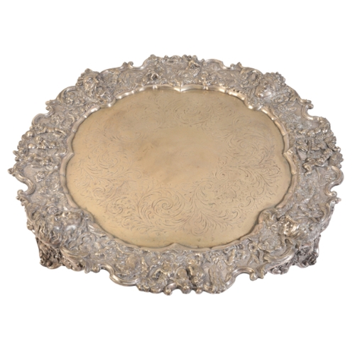 232 - 'THE APCAR PLATE' an impressive late 19th Century silver plated salver, boldly cast in relief with f... 