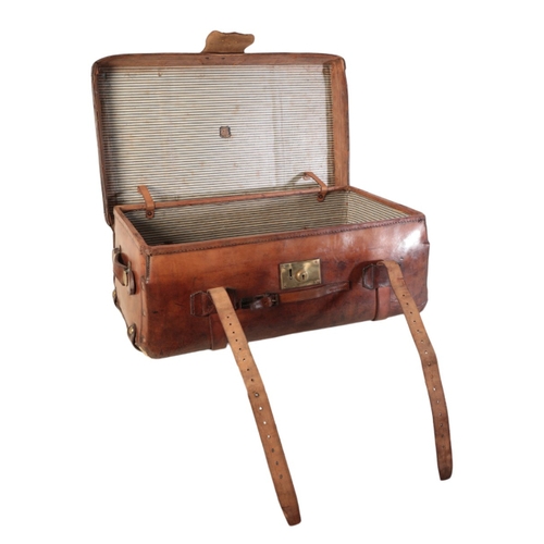 257 - A VICTORIAN LEATHER AND BRASS-BOUND TRAVELLING TRUNK with leather carrying handles and straps, inscr... 