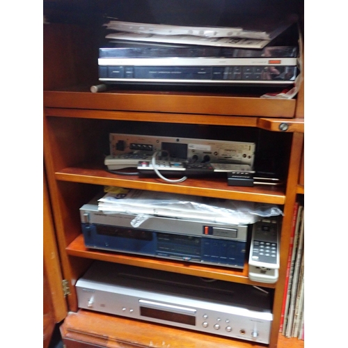 138 - AN ONKYO HI-FI SYSTEM, AND A QUANTITY OF LP RECORDS and tapes, in a reproduction cabinet