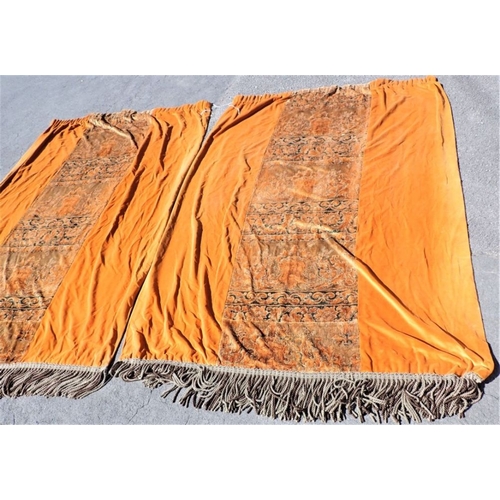 196 - A PAIR OF BURNT ORANGE VELVET CURTAINS, WITH CENTRAL FIGURED PANELS with metallic thread work, and b... 