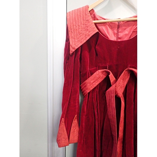 222 - A LONG RED VELVET MEDIEVAL STYLE DRESS with a sequin and embroidered gown with belt and a red pleate... 