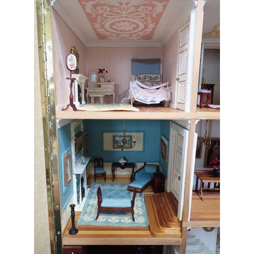 228 - A LARGE FULLY FURNISHED FOUR-STOREY DOLLS HOUSE in the style of a 19th century town house, three flo... 