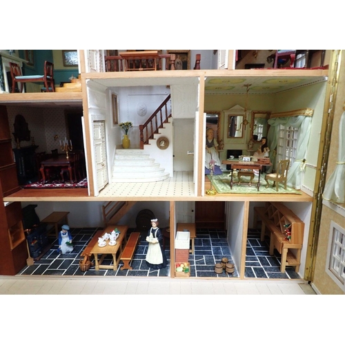 228 - A LARGE FULLY FURNISHED FOUR-STOREY DOLLS HOUSE in the style of a 19th century town house, three flo... 