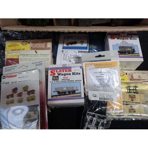 239 - A COLLECTION OF RAILWAY WAGON KITS various makers, with a large collection of 00 gauge railway build... 