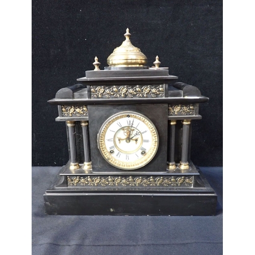 301 - AN ANSONIA SLATE-CASED MANTEL CLOCK of architectural form, with visible escapement, striking on a go... 