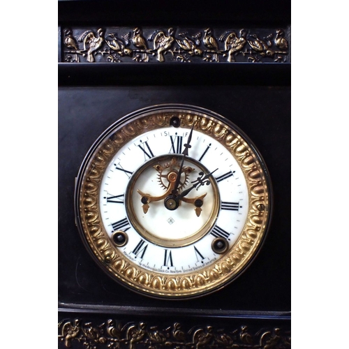 301 - AN ANSONIA SLATE-CASED MANTEL CLOCK of architectural form, with visible escapement, striking on a go... 