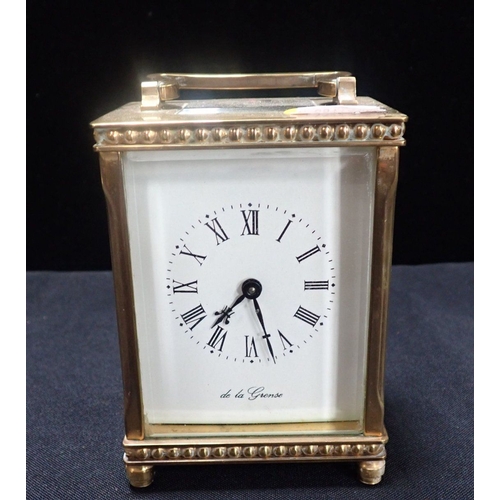 304 - A CARRIAGE CLOCK BY DE LA GRENSE, OXFORD with beaded borders (with key, running)