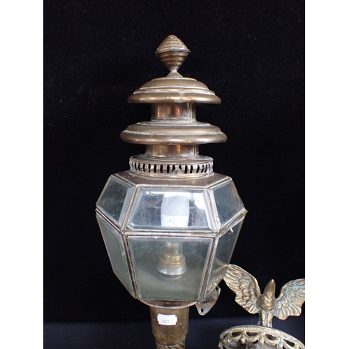 309 - TWO PAIRS OF WALL-MOUNTED BRASS LANTERNS one with eagle surmount, electrified, 68cm and 53cm high