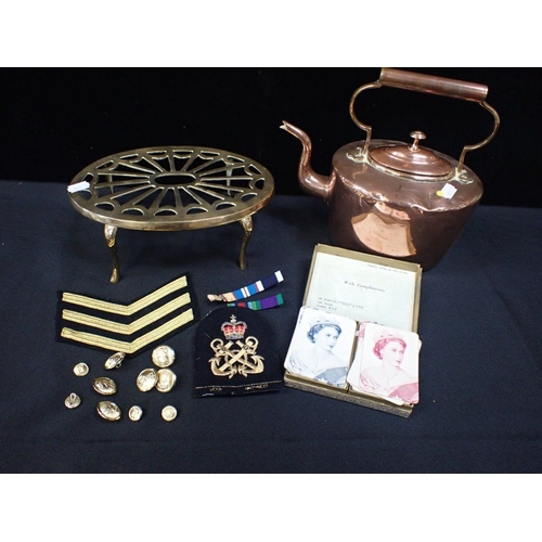 AN OLD COPPER KETTLE, BRASS TRIVET Naval buttons and badges, and playing  cards