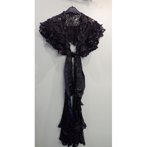 36 - A BLACK METAL THREAD EMBROIDERED CHIFFON DRESS with a lace and embroidered gown and a ruffled chiffo... 