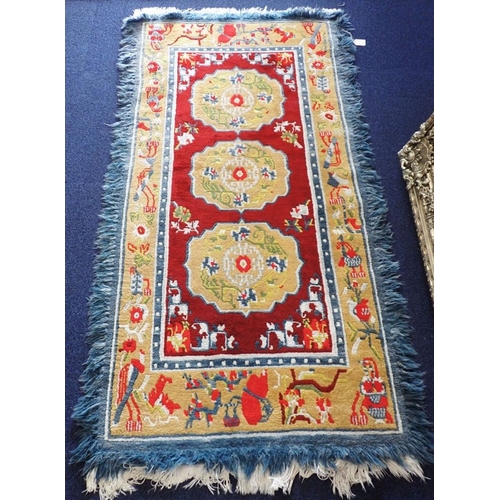 A BRIGHT WOOLLEN RUG Made in India by Tibetan Refugee Self Help Centre