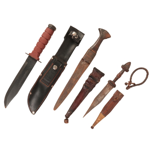 189 - A MILITARY SURVIVAL KNIFE

in the original leatherette scabbard and knife sharpener; and two African... 