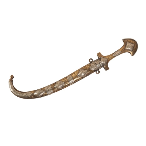 192 - AN EASTERN JAMBIYA

with curved blade, the brass and white metal-mounted grip decorated with geometr... 