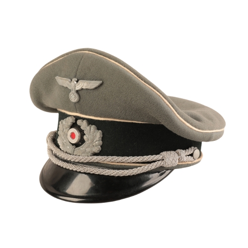 212 - A WWII GERMAN INFANTRY OFFICER'S VISOR

an excellent example, complete with Eagle and Cockade and bu... 