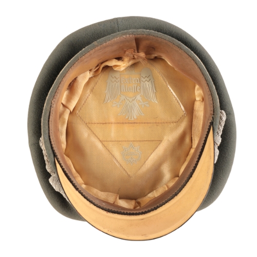 212 - A WWII GERMAN INFANTRY OFFICER'S VISOR

an excellent example, complete with Eagle and Cockade and bu... 