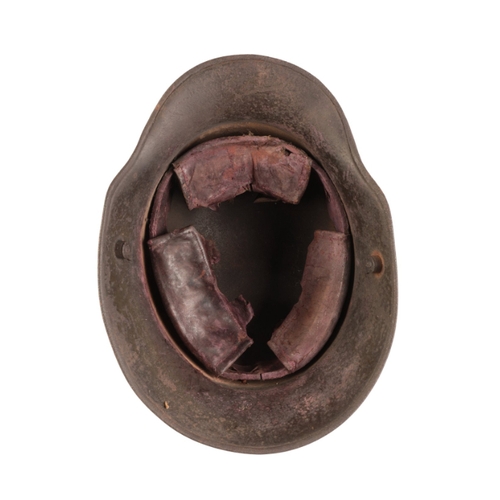 214 - AN ORIGINAL MODEL 1916 GERMAN HELMET

Great War M16, showing signs of field use, the chin strap is m... 