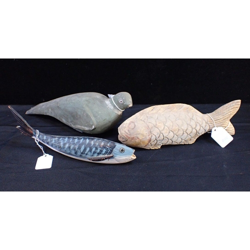 124 - AN OLD WOODEN DECOY PIGEON

37cm long (damage, woodworm), with a Geoffrey Bickley carved fish (a/f),... 