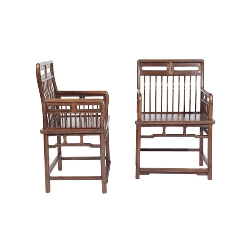 1 - A PAIR OF CHINESE 'HUANGHUALI' COMB-BACK CHAIRS

probably early Qing, the fine spindle backs each fl... 