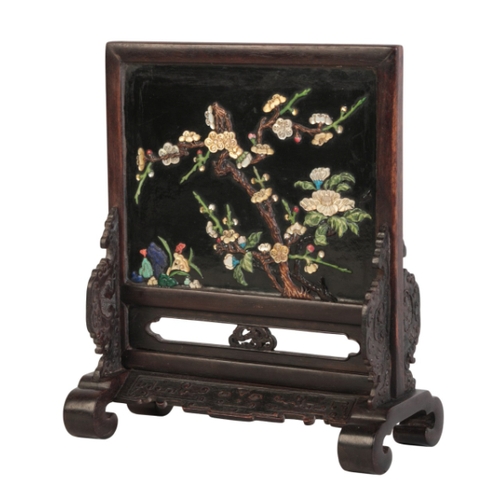 111 - A CHINESE CARVED AND LACQUERED HARDWOOD TABLE SCREEN

the stand carved in low relief with archaic mo... 