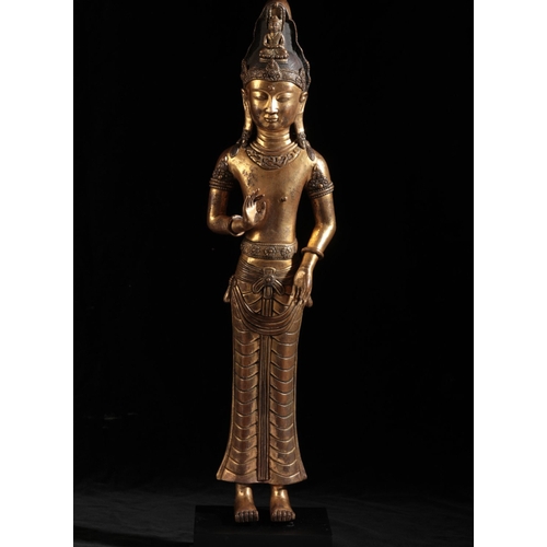 14 - A SINO-TIBETAN GILT BRONZE DEITY

probably Tang, with finely chased detail and a patinated finish to... 