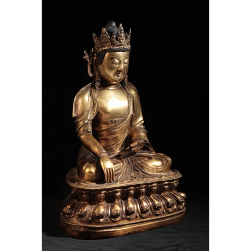 15 - A CHINESE GILT-BRONZE BUDDHA

early Ming or later, the Deity seated on a lotus-leaf base with finely... 