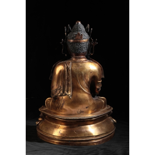 15 - A CHINESE GILT-BRONZE BUDDHA

early Ming or later, the Deity seated on a lotus-leaf base with finely... 