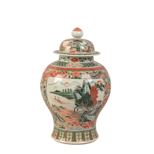 41 - A CHINESE FAMILLE VERTE VASE

in the Kangxi style, the baluster body with a domed cover, enamelled i... 