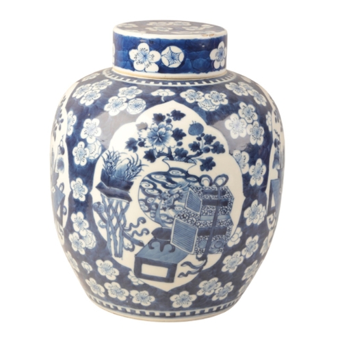 43 - A CHINESE BLUE AND WHITE PORCELAIN GINGER JAR AND COVER

in the Kangxi style, decorated with panels ... 