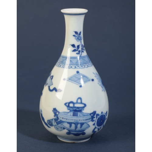 44 - A CHINESE BLUE AND WHITE BALUSTER VASE

in the Kangxi style, decorated with precious objects and flo... 