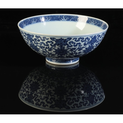 53 - A CHINESE BLUE AND WHITE BOWL

with heaped and piled decoration of lotus flowers and scrolls above a... 