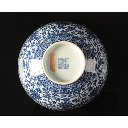 53 - A CHINESE BLUE AND WHITE BOWL

with heaped and piled decoration of lotus flowers and scrolls above a... 