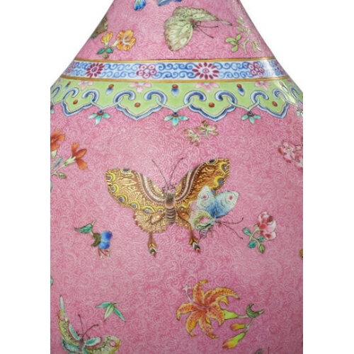 60 - A FINE CHINESE FAMILLE-ROSE PINK GROUND VASE

enamelled in polychrome with butterflies and flowers, ... 