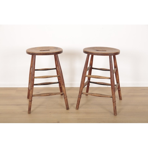 508 - A GROUP OF SIX COUNTRY ELM STOOLS

each with pierced oval seats on turned legs joined by stretchers,... 