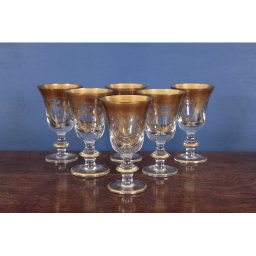 547 - A COLLECTION OF ITALIAN PARCEL GILT GLASSWARE

20th century, including nine large wine glasses, 16.5... 