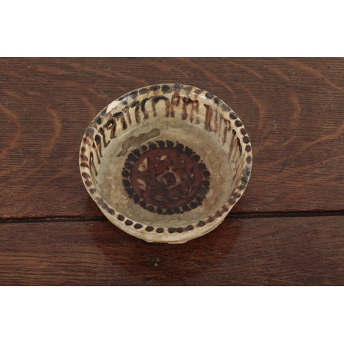 558 - A 'SELJUK' POTTERY BOWL

decorated with Kufic script banding to the interiors, 4cm high x 11cm wide