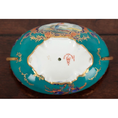 570 - TWO ROYAL CROWN DERBY BONE CHINA TWO-HANDLED URNS

of scrolled oval shape, one turquoise ground with... 